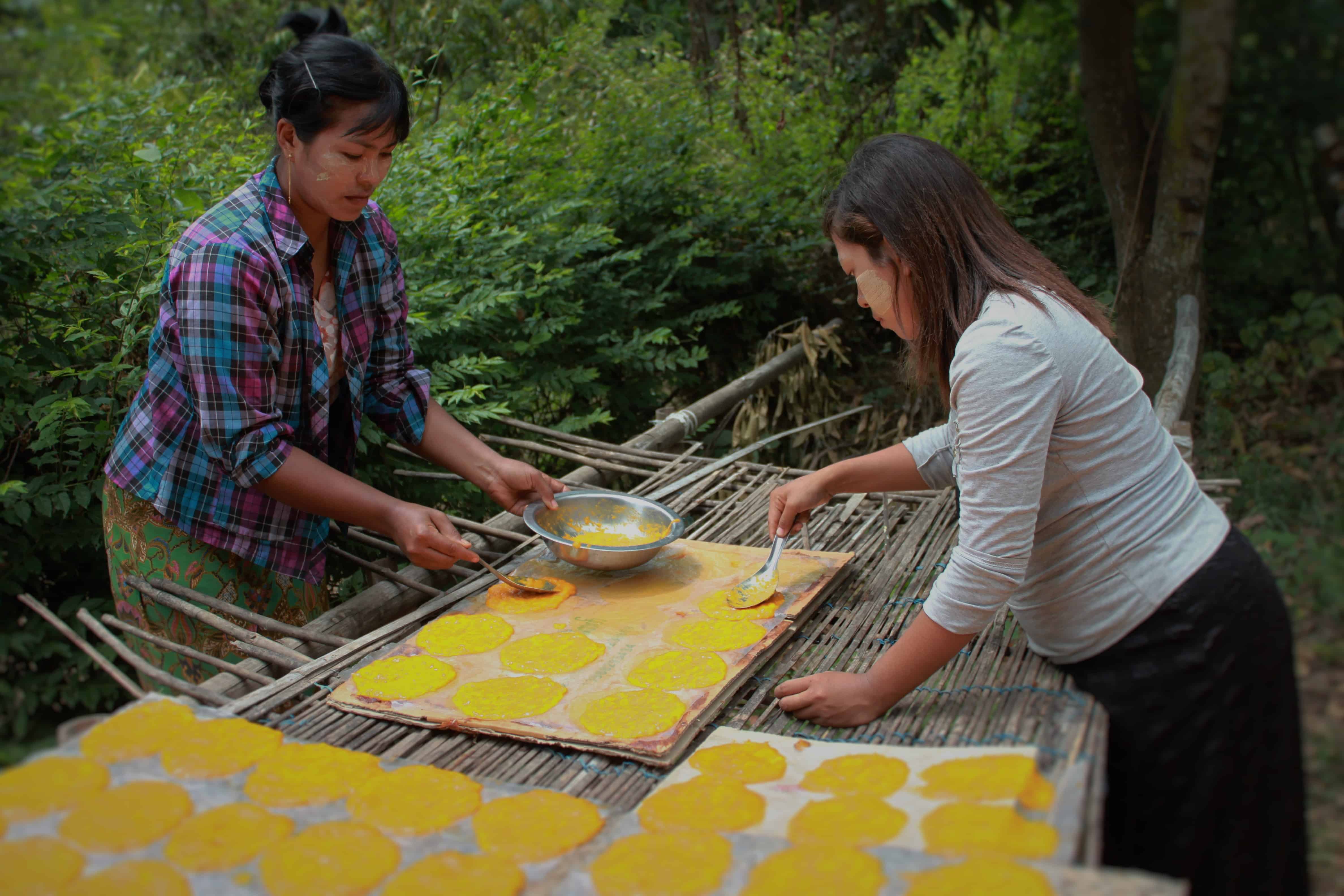 Mandalay Mango Farmer Group women using the new drying racks for mango leather production | Photo courtesy of Winrock